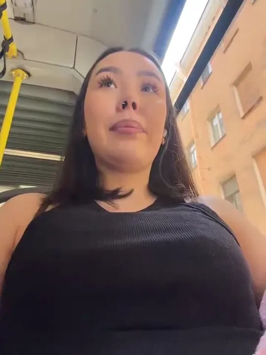 Asian Girl in Pink Jacket Teasing on Public Transport
