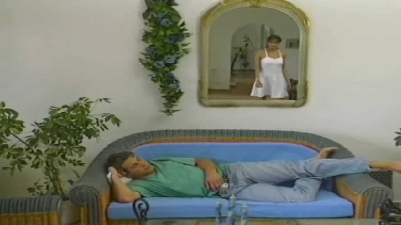 Seductive Brunette MILF on the Couch: Unforgettable Adult Encounter